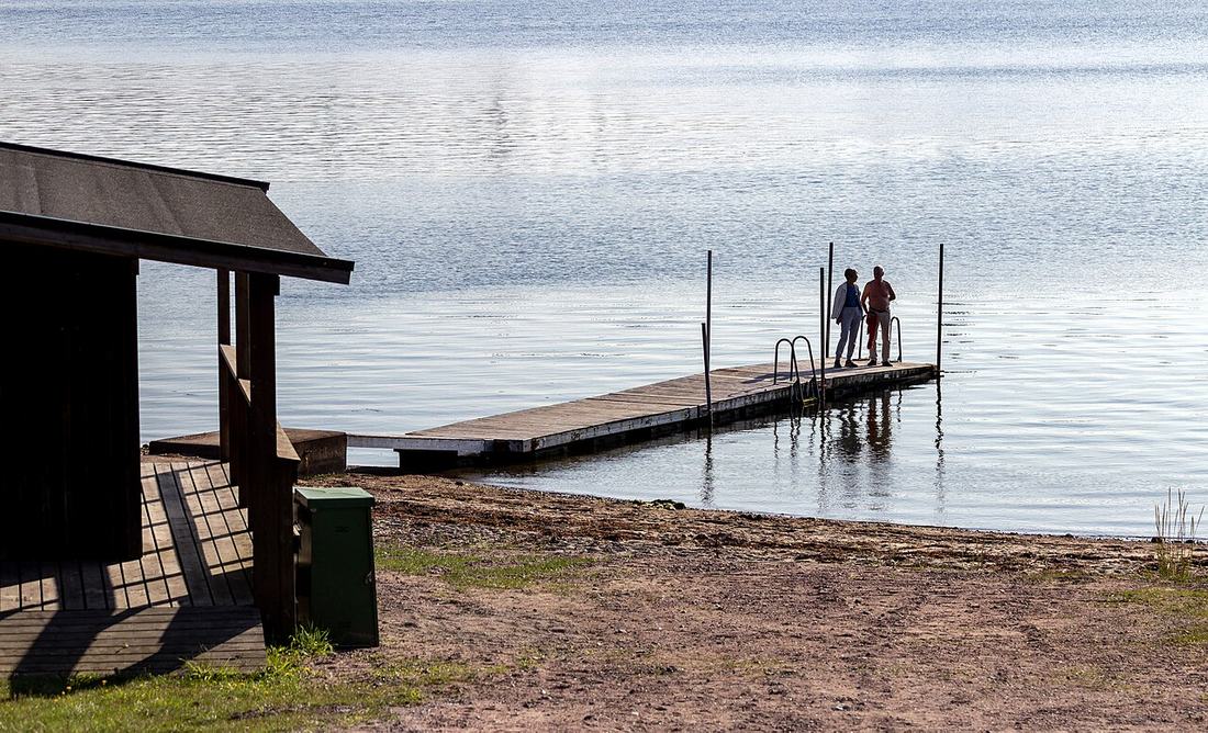 A couple on a jetty at Röhälla beach, Govik
